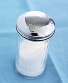 A sugar shaker containing sugar
