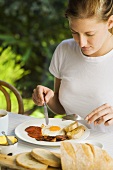 Woman with English breakfast