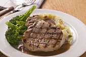 Grilled pork chop with broccoli and mashed potato