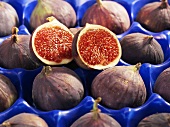 Half and whole figs in a crate