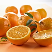 Whole oranges and one halved orange