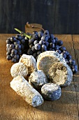 A selection of goat's cheeses and grapes
