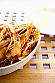 A dish of empty scampi shells (remains of a meal)