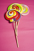 Three coloured lollipops