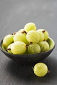 Green gooseberries in bowl