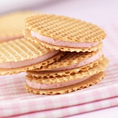 Wafers sandwiched together with strawberry cream