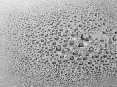 Drops of water on grey surface