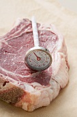 Meat thermometer on beef steak