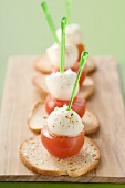 Cherry tomatoes with mozzarella on toasted white bread