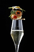 Canapés on glass of champagne