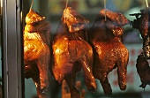 Roast chickens on a market stall in Malaysia