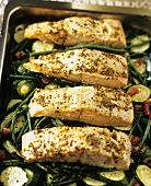 Salmon fillet with mustard seeds on courgettes and beans