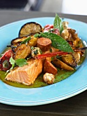 Salmon dish with sausage and potatoes