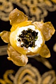 Rockefeller's eggs (Potato with quark and black caviar)