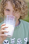 Boy drinking a glass of milk