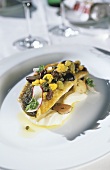 Fried sea bass with raisins, capers and cauliflower