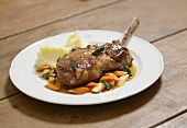 Organic pork chop with mashed potato, vegetables and sage