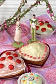 Heart-shaped cakes, muffins and young lover figurines