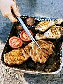 Pork, chicken and vegetables on mini-barbecue