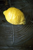 A lemon in a wire basket