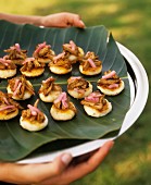 Barbecue appetisers on banana leaf