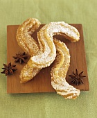 Churros (Spanish fried pastries) with star anise