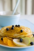 Pancakes with honey and fruit