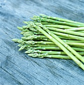 Green asparagus on wooden background