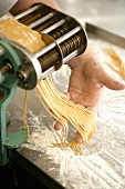 Pasta coming out of a pasta maker