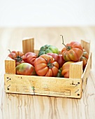 Beefsteak tomatoes in a wooden box
