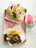 Pita bread filled with pork fillet, mango and spinach