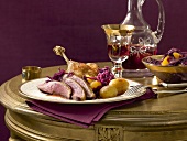 Roast duck with red cabbage and oranges