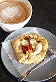 Tomato and cheese tart with caffè latte