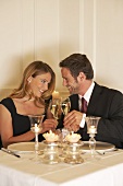 Young couple clinking glasses of champagne
