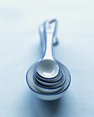 Four enamel measuring spoons