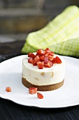Apricot mascarpone cake with strawberries on biscuit base