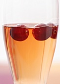A glass of cranberry vodka