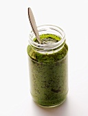 A Jar of Pesto with Spoon