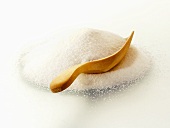 A Pile of Granulated Sugar with Wooden Scoop