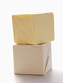 Two Cubes of Wrapped Butter