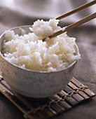 A Bowl of Cooked Rice with Chopsticks