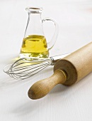 Rolling pin, whisk and carafe of oil