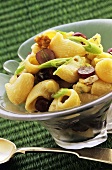 Pasta salad with grapes and spring onions