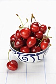 Fresh cherries in a ceramic bowl