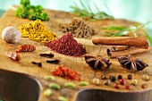 Various spices on a wooden board
