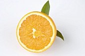 Half an orange with leaves
