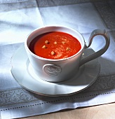 Tomato soup with croutons in a mug