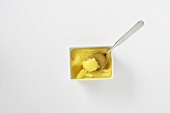 Clarified butter in a bowl with a spoon