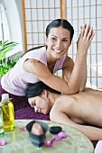A woman having a back massage in a spa