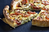 Tomato quiche with leek and feta, sliced